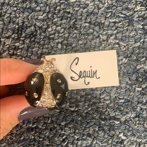 Back and gold ladybug ring